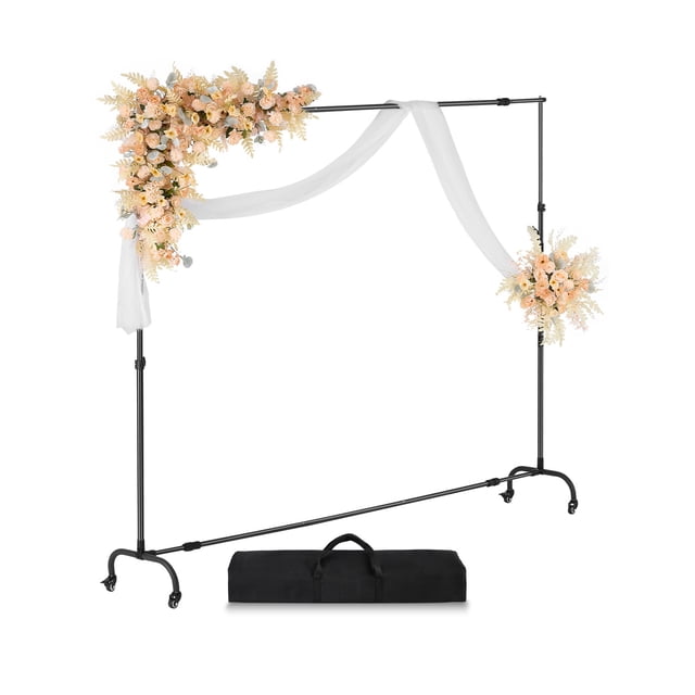 VEVOR Backdrop Stand Movable Stand Kit 7 x 10 ft, featuring a black carbon steel frame with adjustable height and width, movable casters, and a horizontal bar for stability. The stand is decorated with floral arrangements and white drapes, ideal for parties, weddings, and photo or video studios. Includes a black carrying bag for portability.