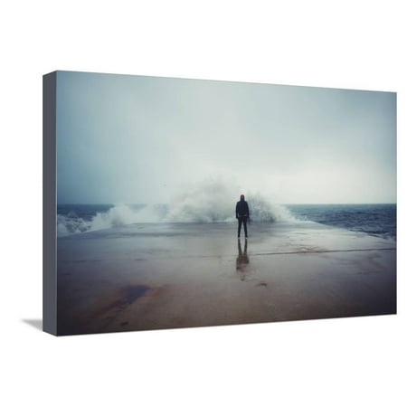 Back View Portrait of Young Man Standing against the Sea on a Large Concrete Pier with Big Wave Bea Stretched Canvas Print Wall Art By