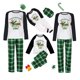 thumbnail image 1 of Pijamas familiares a juego de Navidad, conjunto de pijamas de Dachshund a través de la nieve verde, 1 of 3