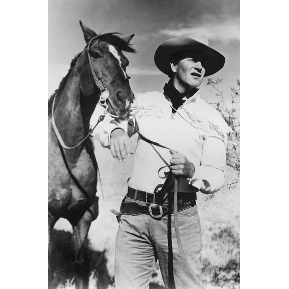 John Wayne in Red River 24x36 Poster posing with horse