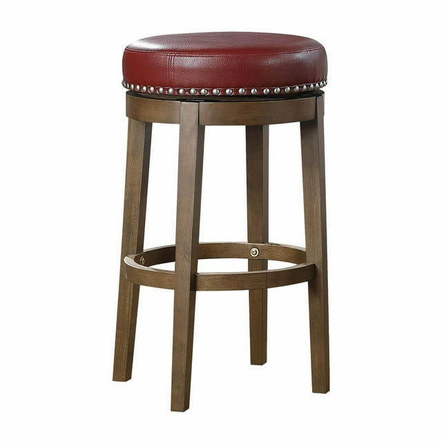 Round swivel pub height stool featuring a red cushioned seat with silver nailhead trim and sturdy brown wooden legs.