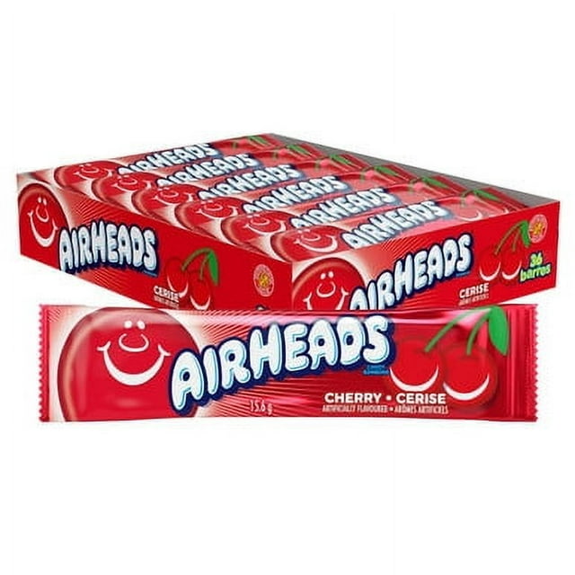 Airheads Individually Wrapped Full Size Bars in Cherry Flavor, featuring a box of 36 bars, each weighing 15.6g. The packaging showcases vibrant red wrappers with the Airheads logo and cherry graphics, emphasizing the tangy and sweet candy flavor. Ideal for sharing, snacking, or special occasions.