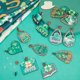 thumbnail image 4 of Kit para hacer aretes de San Patricio (1 caja con 10 pares) con dijes de trébol de cuatro hojas verdes, accesorios de madera para aretes., 4 of 6