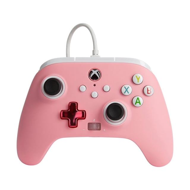 control alámbrico power a xbox series pink Rosa PowerA, vista frontal centrada de control ergonómico para Xbox Series X|S con cable USB desmontable de 10 pies (3 m) blanco; botones A/B/X/Y en colores, dos joysticks simétricos, cruceta metálica rosa, botones estándar y botón Compartir visibles, dos motores de vibración y botones asignables; a menudo usado para sesiones de juego y streaming.