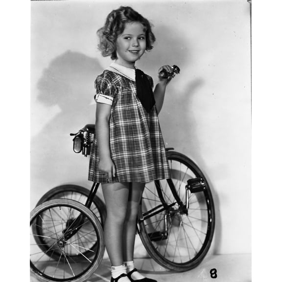 Shirley Temple holding her Tricylce bike Photo Print (24 x 30)