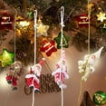 thumbnail image 4 of Novelty Climbing Santa Design: This Christmas Tree Ornament Features A Playful Santa Climbing On A Rope Adding A Whimsical and Unique To Your Holiday De Cor. The Funny, 4 of 6