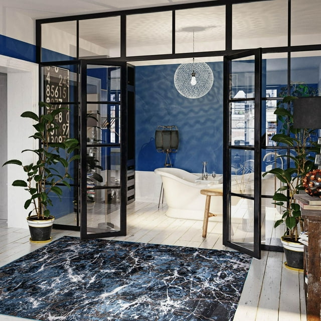 Contemporary marble textured area rug with blue and white veining placed on light wood floor in a stylish living room featuring glass doors, plants, and modern decor.