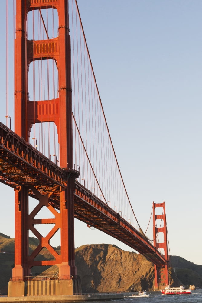 Tour boats cross under Golden Gate Bridge viewed from Fort Point at the entrance to San Francisco Bay Marin Headlands visible in background San Francisco California United States of America Canvas Art