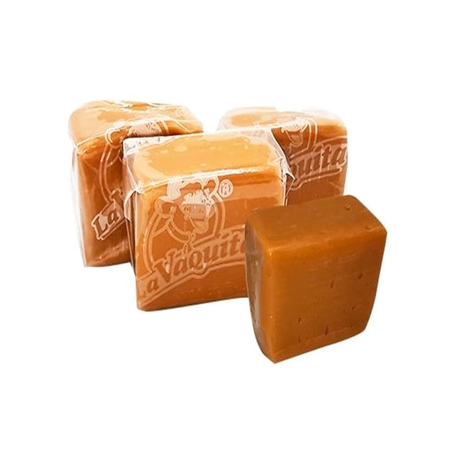 pack de 20 dulce la vaquita chicloso de 400g front-facing view of four square caramel-colored chiclosos, three wrapped in translucent film printed with the La Vaquita logo and one unwrapped showing a smooth, dense surface; set on a white background, ideal para postres y como dulce de despensa, a menudo usado en repostería casera.