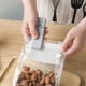 thumbnail image 1 of Mini sellador y cortador de bolsas recargable por USB | Sellador portátil para almacenar alimentos, como papas fritas, refrigerios y sobras | Blanco o gris | Cocina, camping, viajes, 1 of 5