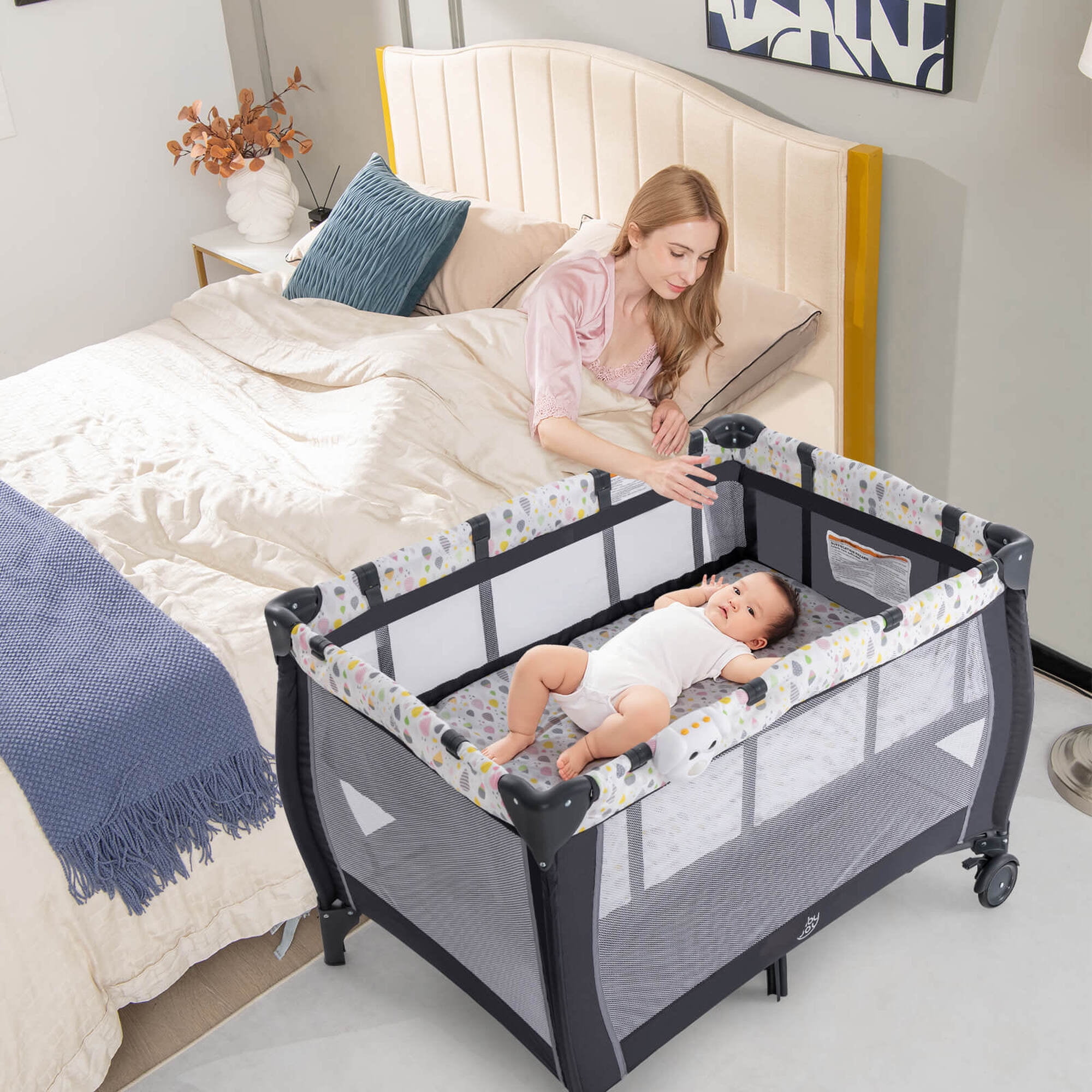 Costway Portable Baby Playard Nursery Center Crib Bassinet with Hanging Toys & Music Box Colorful