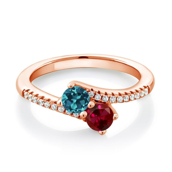 Gem Stone King 18K Rose Gold Plated Silver London Blue Topaz and Red Created Ruby Bypass Ring for Women (0.82 Cttw, Gemstone November Birthstone, Round 4MM, Size 6)