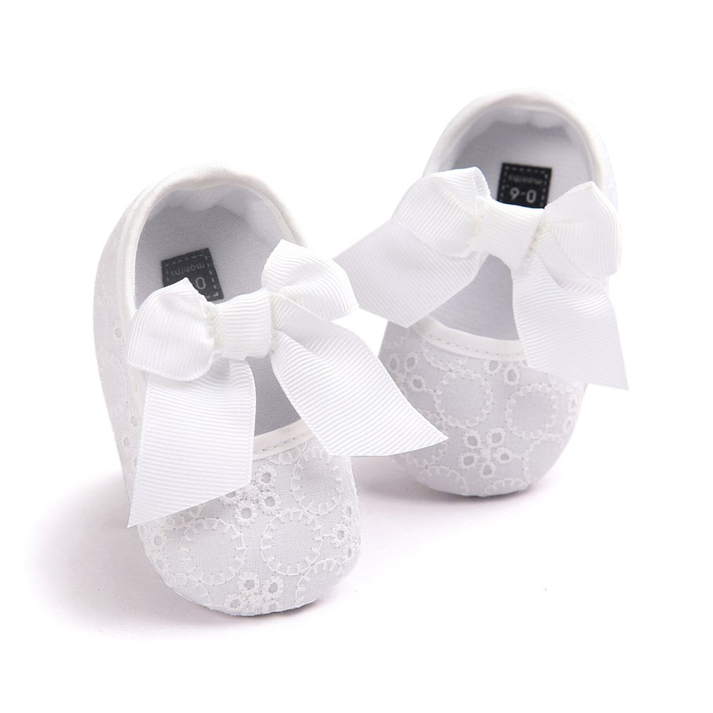 white newborn baby shoes
