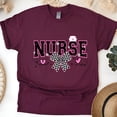 thumbnail image 1 of Nurse Graphic T-Shirt | Black Pink Varsity Lettering with Checkered Bow Tee, Maroon, Size M, 1 of 6