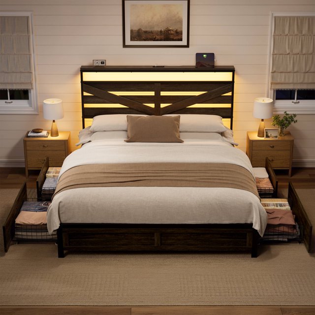 GUNAITO Queen Bed Frame with Storage Headboard & 4 Drawers, designed as a dark gray industrial metal platform bed with built-in charging station and RGB LED lighting. This sturdy steel and wood bed frame offers durability and noise-free use. The headboard includes USB and Type-C ports for convenient device charging, while four under-bed drawers with pulleys provide organized storage for bedding and essentials. Ideal for modern bedroom furniture setups, the bed is displayed in a warm, neutral-toned room with cozy lighting.