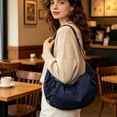 thumbnail image 1 of Bolso bandolera para mujer con borla plisada, bolso de hombro en forma de media luna, bolso de nylon tipo dumpling | Gran capacidad para portátil, tableta y cartera | Tejido suave repelente al agua, 1 of 6