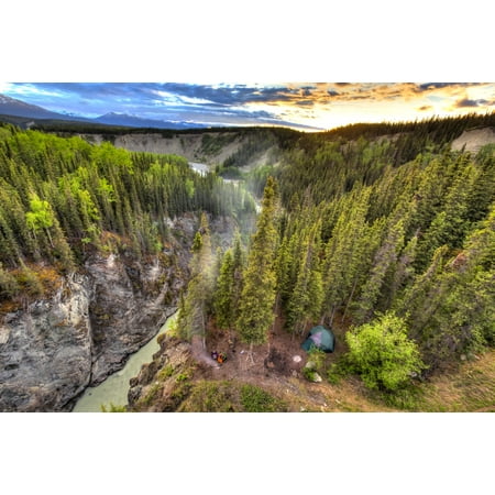 Scenic view of the Kuskulana River Canyon and Wrangell Mountains at sunset from the Kuskulana River Bridge on the McCarthy Road in Wrangell-St Elias National Park and Preserve Southcentral Alaska