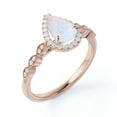 thumbnail image 2 of JeenMata 1.25 Carat Halo Pear Shaped Blue Opal and Moissanite Pavé Promise Ring in 18K Rose Gold over Silver, 2 of 7