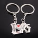thumbnail image 3 of LLavero de corazón de muñeca de dibujos animados de Metal para hombres y mujeres, carta de amor romántica, llavero de pareja, regalos del Día de San Valentín, lindo, 2 piezas, 3 of 3