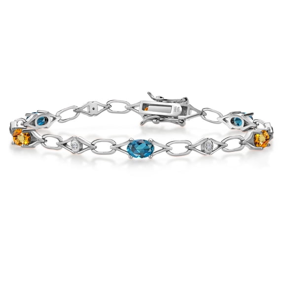 Gem Stone King 925 Sterling Silver London Blue Topaz and Yellow Sapphire and Round White Lab Grown Diamond Tennis Bracelet for Women (3.68 Cttw, Gemstone Birthstone, Oval 6X4MM, 7.25 inches)