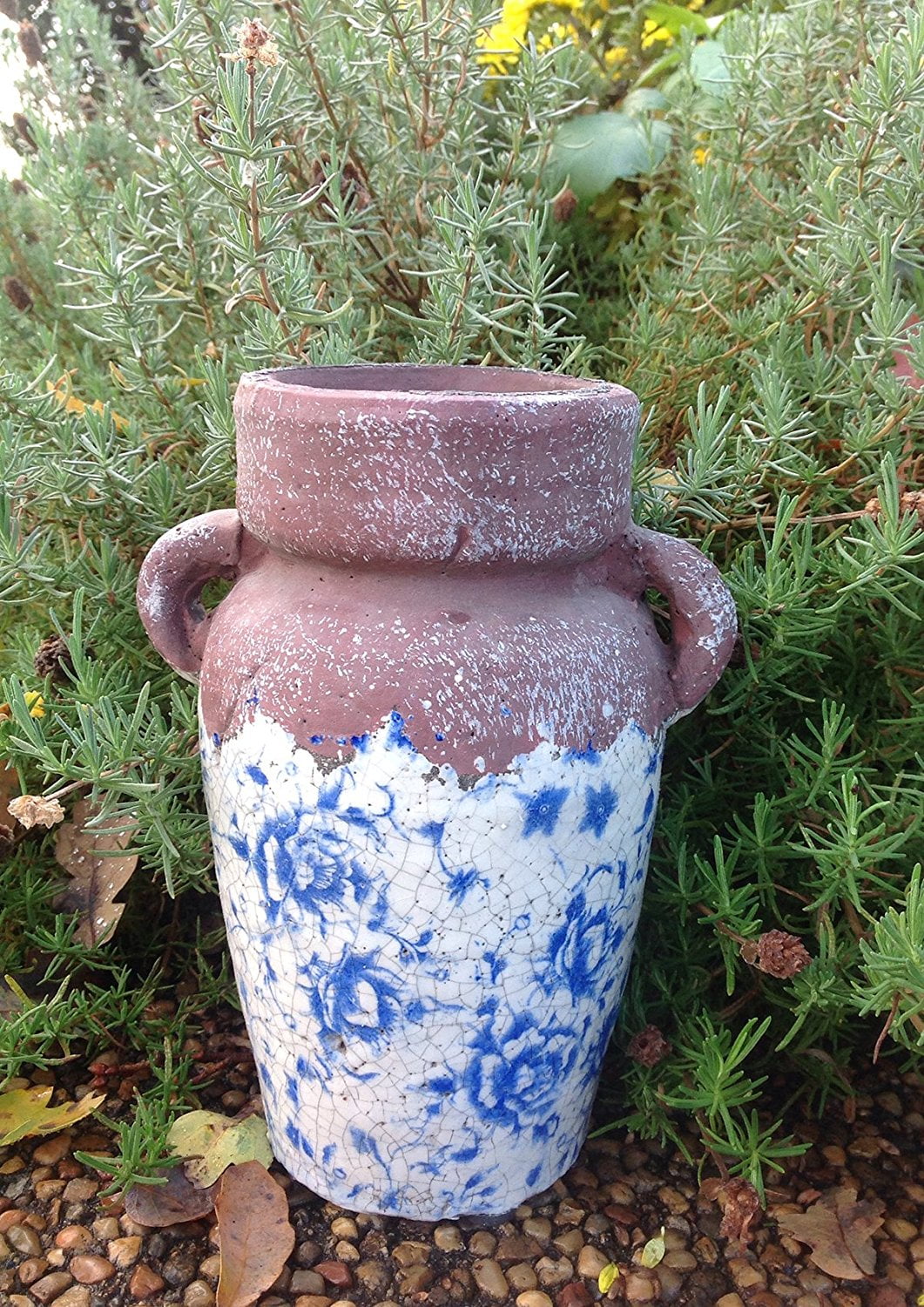 Vintage Old World blue and white ceramic vase. Ancient asian reproduction of a classic storage jug. Highly stressed painted and natural combined finish