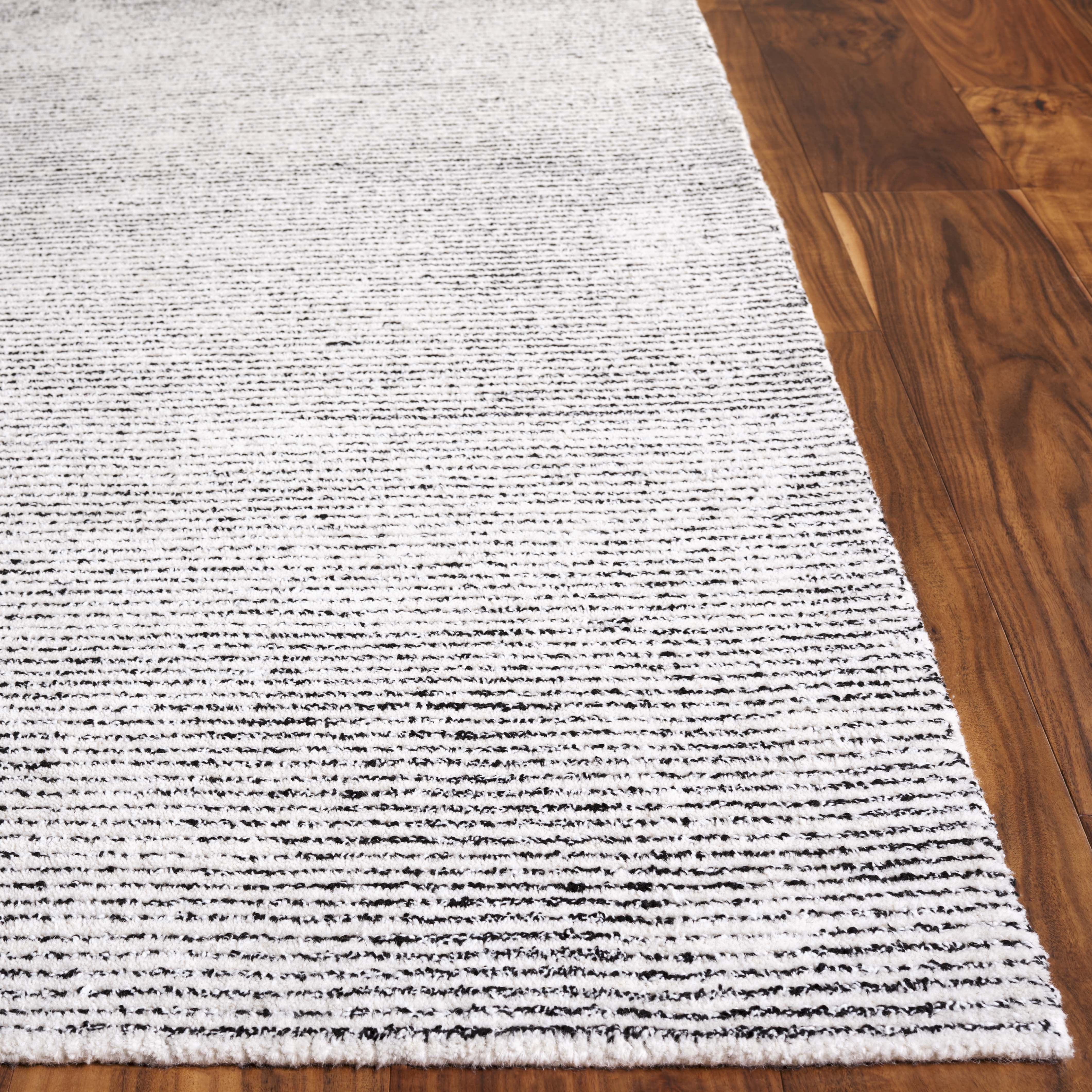SAFAVIEH Abstract Rumen Solid Color Area Rug, Ivory/Black, 3' x 5'