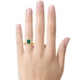 thumbnail image 2 of FJC Finejewelers 10k Yellow Gold 8x6mm Oval Created Emerald with White Topaz accent stones Halo Ring, 2 of 7