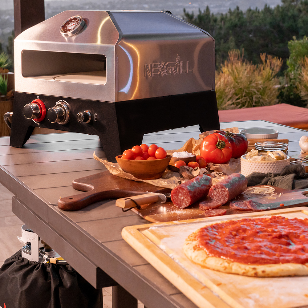 Nexgrill 12" Tabletop Propane Pizza Oven, Cast Aluminum Frame, 15,000 BTUs, Portable Gas Pizza Cooker with Built-In Temperature Gauge, Wood Smoker Box, Rotating Cordierite Pizza Stone - 820-0084B
