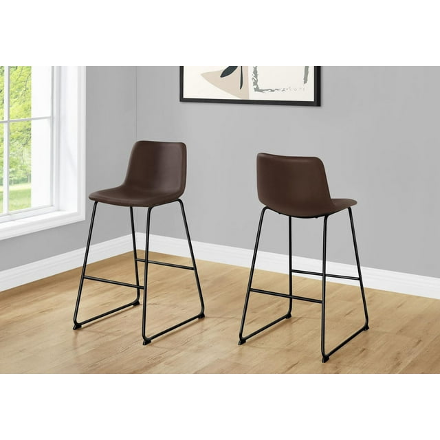 Contemporary Monarch Specialties bar height office chairs with brown PU leather look seats and black metal frames, shown in a bright room with wood flooring.