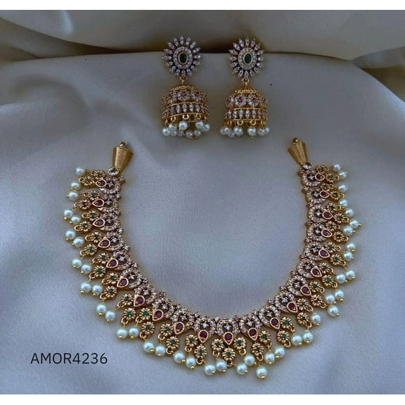 South Indian Ruby CZ Choker Necklace with Green Stone Jhumka Earrings – Gold Plated Bollywood Pearl Jewelry Set