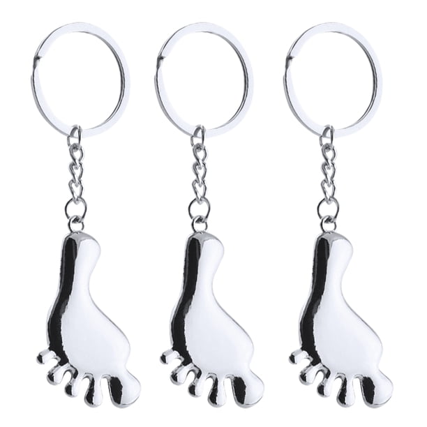 3 llaveros decorativos con forma de pie para bolso o monedero.