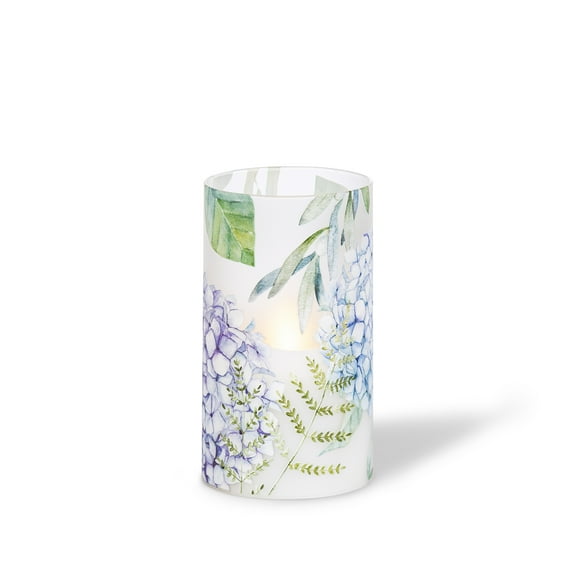 LED 3.5"D X 6"H Hand-Poured Wax Candle w/ Floral Design. Next Gen LED Flame Patented Technology w/ Adjustable Brightness Control. 2 C Batteries (Not Included). Multi Timer Function, 4, 6 & 8 hour.