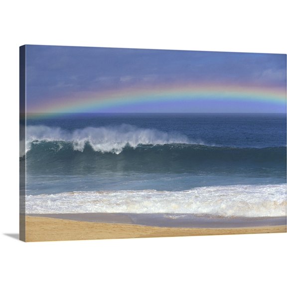 Great BIG Canvas | "Rainbow Over Shore Break Beach Foreground, Horizon And Blue Sky" Canvas Wall Art - 24x16