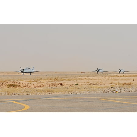 LAMINATED POSTER Three T6 Texan II aircraft move toward their parking spots upon landing at Contingency Operating Bas Poster Print 24 x