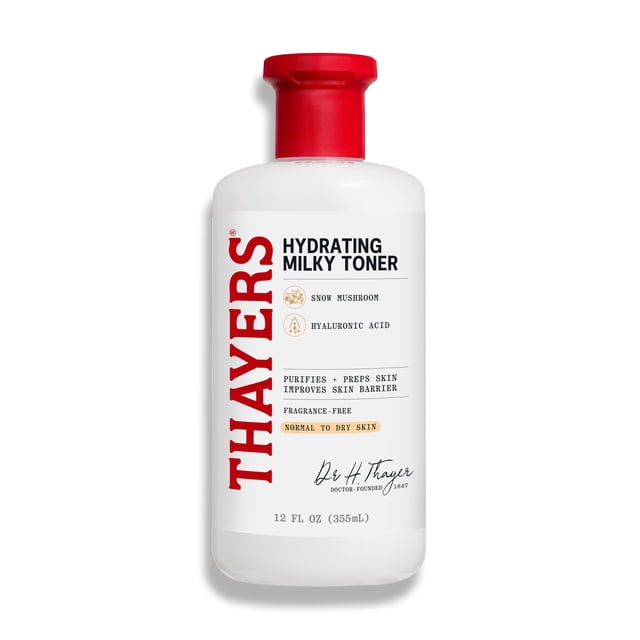 thayers milky face toner skin care with snow mushroom and hyaluronic acid, natural gentle facial toner, for dry and sensitive skin, 355ml — Botella frontal de 355 ml blanca con tapa roja de cierre; etiqueta vertical 'THAYERS' y texto 'Hydrating Milky Toner' que menciona snow mushroom y hyaluronic acid, sin fragancia y para piel normal a seca. Fondo blanco, toma cercana; apto como paso hidratante antes de suero.
