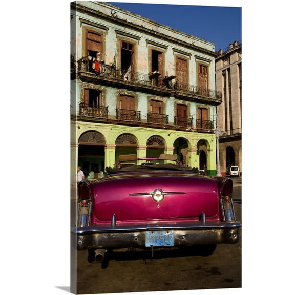 Great BIG Canvas | "Classic 50's Buick in front of old worn and colorful apartment buildings, Havana, Cuba" Canvas Wall Art - 24x36