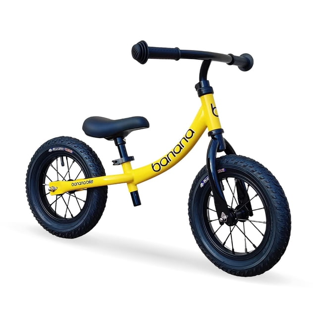 bicicleta de equilibrio banana balance gt, bicicletas sin pedales, manubrio y asiento ajustables amarillo unitalla: bicicleta de entrenamiento en vista 3/4 frontal con cuadro amarillo en forma de plátano, manubrio recto negro, asiento negro ajustable en altura y dos ruedas negras con llantas de radios. Para niños de 2 a 5 años; montaje sencillo de ruedas, manillar y asiento; también adecuada para practicar equilibrio en interiores.