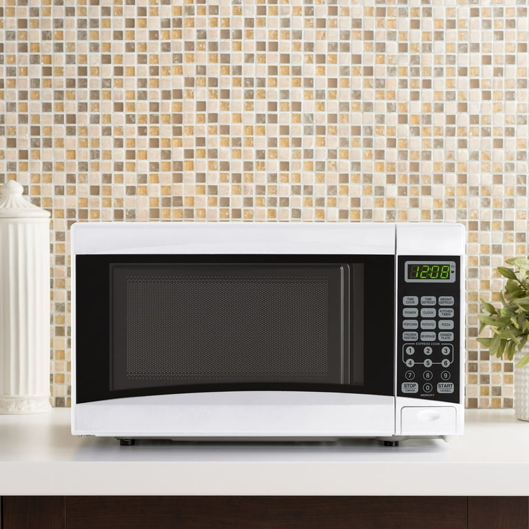 Mainstays 0.7 Cu ft Countertop Microwave Oven, 700 Watts, White, New