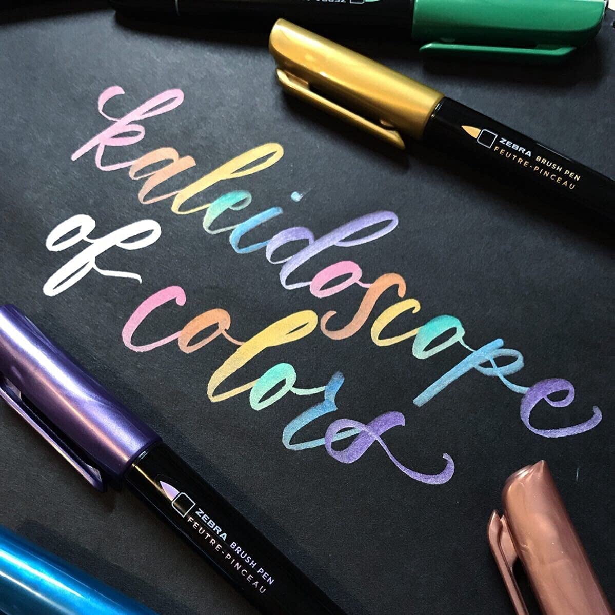 JJEAN-, Metallic Brush Pens, Assorted Metallic Ink Colors, Medium Brush Tip Mimics Artist‘s Paint Brush for Calligraphy, Acid-Free Ink for Light and Dark Paper, 7-Pack (01607)