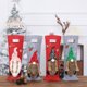 thumbnail image 1 of Cubierta de botella de vino de Navidad | Decoración festiva de la bolsa de vino de tela sin tejida para la mesa navideña | Funda protectora blanda | Rojo, Rosa, Negro, Verde | 16,1x5,5 in, 1 of 6