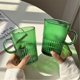 thumbnail image 4 of Taza de vidrio verde con asa, 16 oz, diseño de rayas verticales, 4 of 6