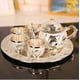 thumbnail image 1 of Juego de té blanco plateado, cuatro tazas por plato, una tetera pequeña, taza de té Kung Fu, estilo de alta gama, 1 of 6