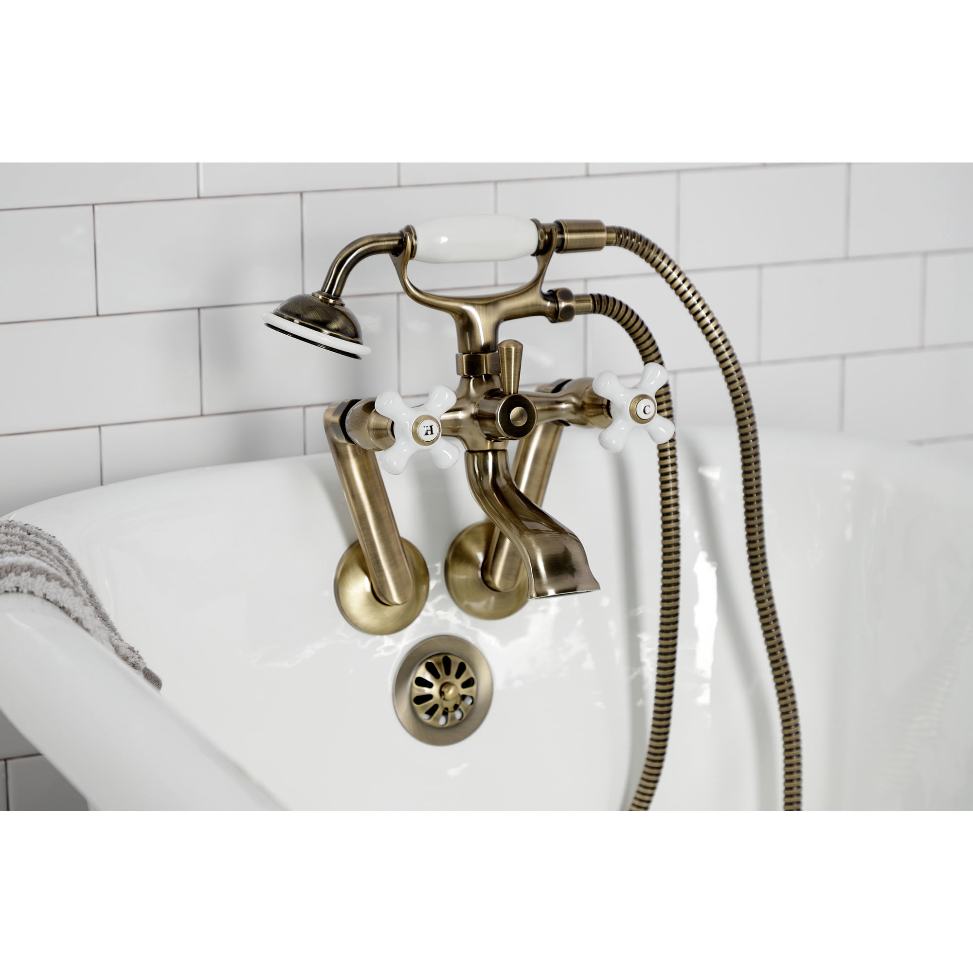 Kingston Brass KS269PXAB Kingston Three-Handle 2-Hole Tub Wall Mount Clawfoot Tub Faucet with Hand Shower in Antique Brass