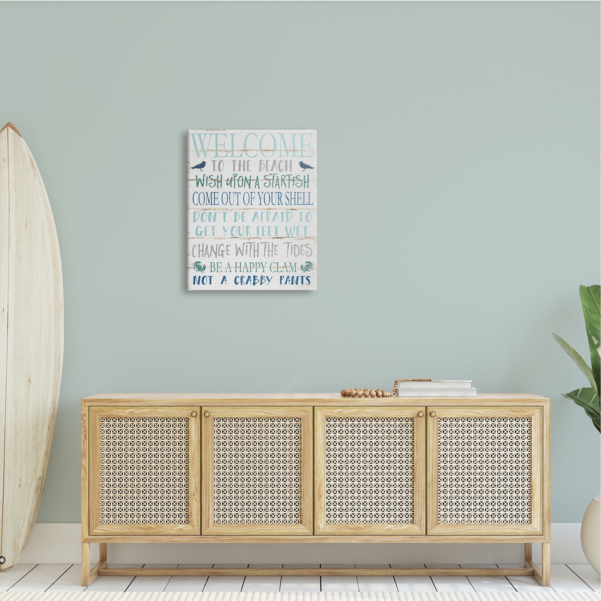 The Stupell Home Decor Welcome to the Beach Blue Aqua and White Planked Look Sign
