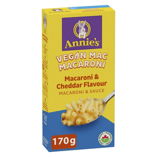 Annie's Vegan Macaroni & Cheddar Flavour, Canada Organic, 170 g box with yellow and blue packaging showing a spoonful of creamy vegan macaroni and cheddar sauce, featuring the Annie's bunny logo and Canadian organic certification.