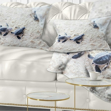 UPC: 0671131496422 | DESIGN ART Designart Baby Green Turtles on Sand Animal Throw Pillow 12 in. x 20 in. Medium