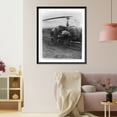 thumbnail image 3 of Historic Framed Print, Final check is made by Capt. Robert Crilly of the Army Medical Corps just before a helicopter of the Army's 2nd Helicopter Detachment takes off for a rear ar, 17-7/8" x 21-7/8", 3 of 9