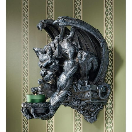 Design Toscano Whitechapel Manor Gargoyle Wall Sconce Imagine the drama when this menacing gargoyle lowers his mysteriously flickering candlelight to illuminate your castle entryway. With bat-like wings  master gargoyle artist Chang s intimidating fellow stoops from his Gothic plinth in a sculpture full of movement and imagination. Intricately sculpted  then cast in quality designer resin and hand-painted to resemble aged stone  this piece can be found only at Toscano! Candle not included. Do not leave lit candles unattended. 10in Wx11½in Dx13in H. 5 lbs.