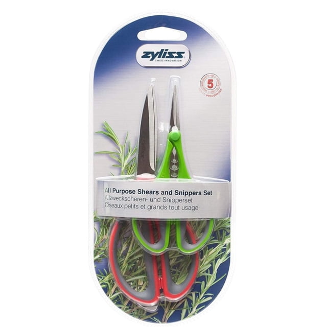 tijeras y pinzas de cocina zyliss e910016u juego en blister, vista frontal centrada con tijeras grandes y pinzas pequeñas; hojas de acero inoxidable japonés y cuchilla micro dentada visible, mangos suaves antideslizantes según especificación, empaque con logo Zyliss y fondo ilustrado de hierbas; también suele usarse para cortar y recoger hierbas frescas en la cocina.