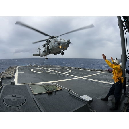 LAMINATED POSTER An SH-60F Sea Hawk helicopter assigned to the Red Lions of Helicopter Anti-submarine Squadron lands Poster Print 24 x 36